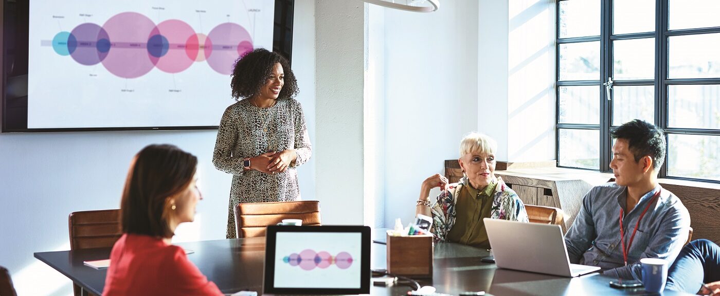 Attractive businesswoman heads strategy meeting in board room